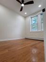 Hardwood flooring, recessed lighting, ceiling fan, and window