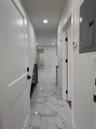 White tile flooring with grey veining