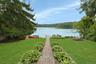 A Unilock paver walkway leads you directly to the lake, where days of waterfront enjoyment await. Laps first thing in the morning or to wash away the 