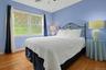 Bright and welcoming, the third  bedroom provides a comfortable retreat for family and guests