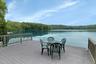 Additional private Trex waterfront deck and dock are the perfect launch point for boating, kayaking, fishing, swimming, and simply enjoying life on th