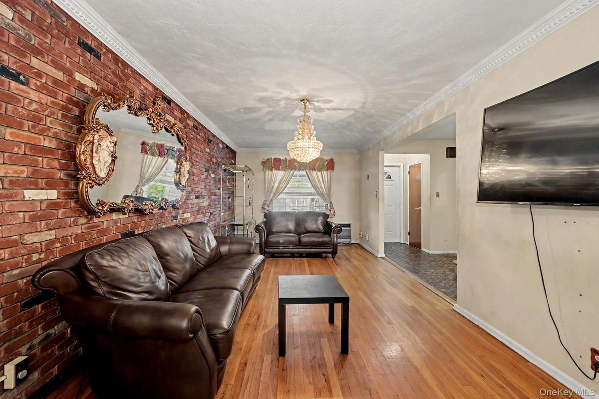 Living room with view to front entrance foyer.