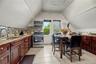 Updated eat-in kitchen with abundant cabinetry and counter space.