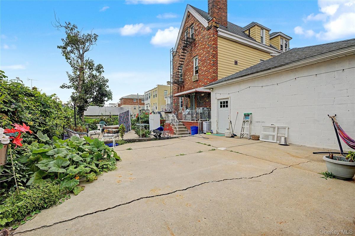 Expansive private driveway leading to detached two-car garage.