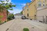Spacious private driveway with detached two-car garage and ample parking.