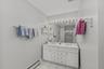 Conveniently located, the hall bath serves both upstairs bedrooms and offers easy access for both bedrooms