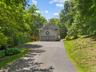 Tucked away at the end of River Road, a generous driveway welcomes you home, leading to the two-car garage and offering ample parking for both you and