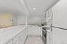 With generous counter space and recessed lighting, the lower-level kitchen provides the perfect setting for entertaining, hosting celebrations, and ga
