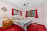 The second upstairs bedroom offers a comfortable, inviting space with convenient access to the nearby hall bath.