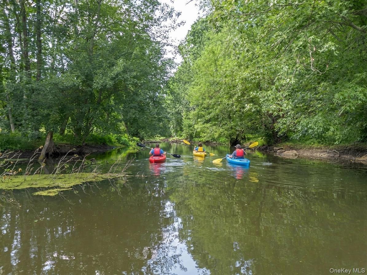 An idyllic riverside sanctuary offering endless opportunities for recreation, including canoeing, paddleboarding, kayaking, fishing, or simply relaxin