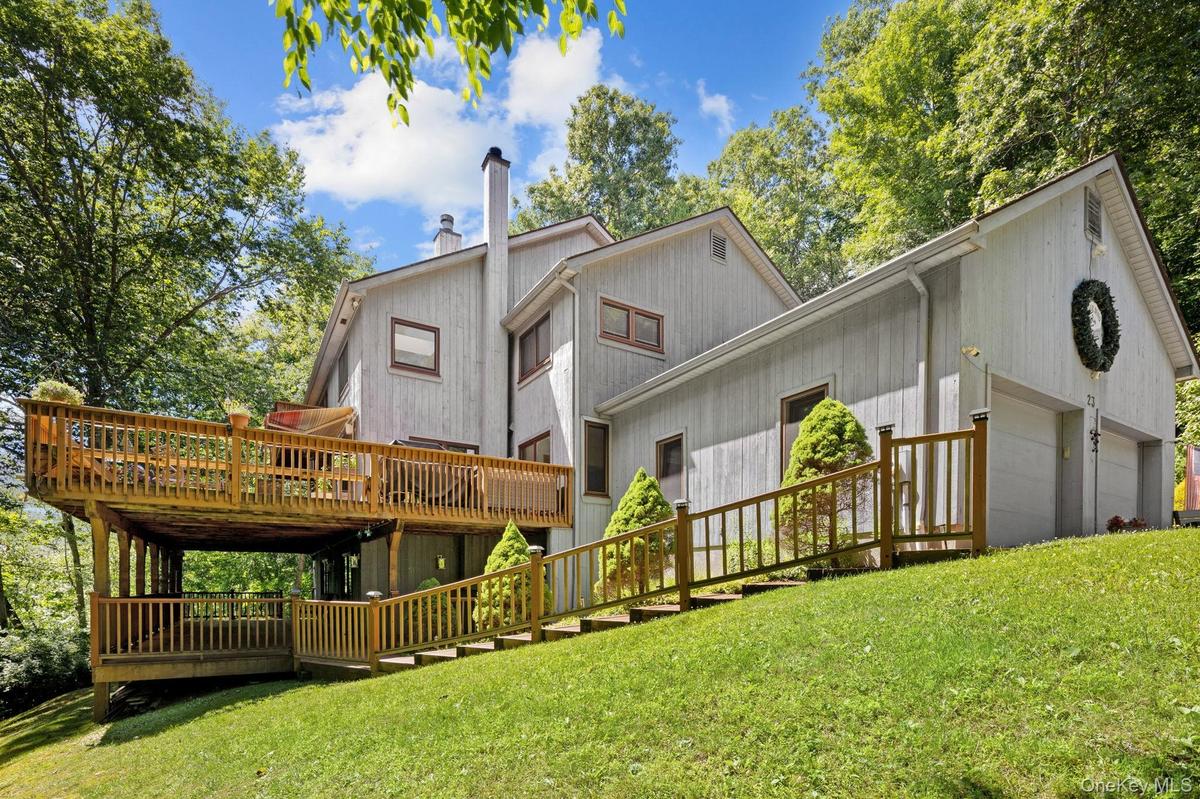 Three levels of expansive decking extend the living space outdoors, creating the perfect setting for summer gatherings, special celebrations, and year