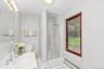 Completing the main level are a full bath and conveniently located laundry room, adding comfort and functionality to the home’s thoughtfully designed 