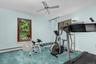 Currently used as an exercise space, this versatile bedroom offers the flexibility to easily transition back to a comfortable sleeping retreat.