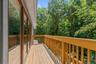 A private balcony off the primary bedroom invites you to sip your morning coffee, welcome the day, and enjoy the natural surroundings