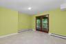 An additional room adds even greater versatility to the lower level, offering flexible space that can easily adapt to a variety of daily uses.