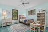 Virtually staged to showcase its potential as a warm and inviting bedroom, highlighting the room’s versatility and comfortable proportions.