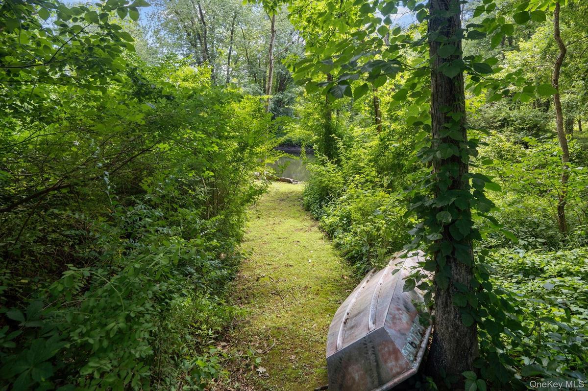 Your exclusive riverside path leads to an exceptionally crafted, multilevel residence thoughtfully designed to complement its  natural surroundings.