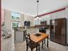 View from the updated chef-friendly kitchen through the dining room and out to the deck.