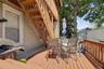 Wood-finish deck with a wood railing and exterior staircase