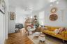 Hardwood flooring throughout, multiple windows, and crown molding