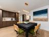 PERFECT DINING SPACE WITH COFFEE BAR/SERVING AREA, CABINETRY AND 2 PANTRIES