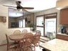Spacious dining area fits a full-size dining table. The large opening looks into the family room.