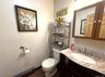 1st floor half bath. Pretty vanity has a granite top.