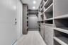 Custom walk-in closet with built-in shelving and drawers