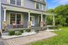 Classic rocking chair covered front porch, a home you will be proud to call your own