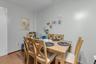 Hardwood flooring, light-toned wall paint, and a white door.