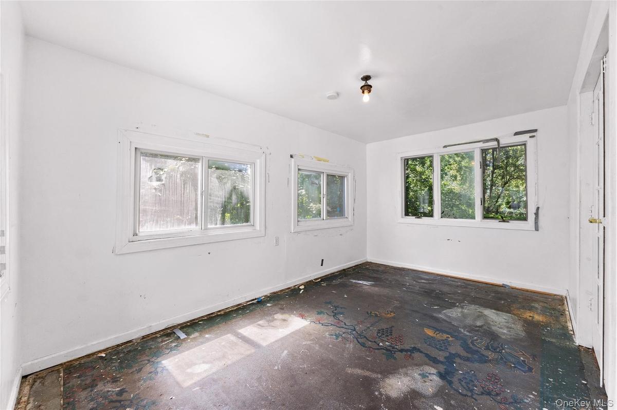 Unheated sunroom off living room.