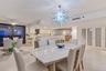 Warm light from the dining area flows into the kitchen with plenty of place to sit and catch up on the day while you prepare a prefect meal.