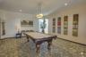 Billiard area of the parlor located in the common area building and upstairs from the fitness room.