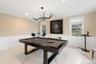 Rec room with marble tiled flooring, billiards, crown molding, a wainscoted wall, and a decorative wall