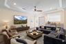 Entertainment room/Den with staged furniture for perspective.