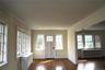 Another angle of the den with the exit outside and the living room to its right
