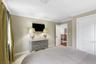 Crown molding and neutral wall tones create a refined aesthetic