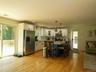 Updated gourmet kitchen with stainless steel appliances, plenty of room at the built-in granite island, in addition to a separate dining area.