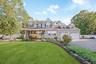Two-story residence with a covered front porch and dormer windows
