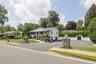 White siding exterior with a covered front porch and column accents