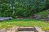 2 steps up from rear patio to grassy area