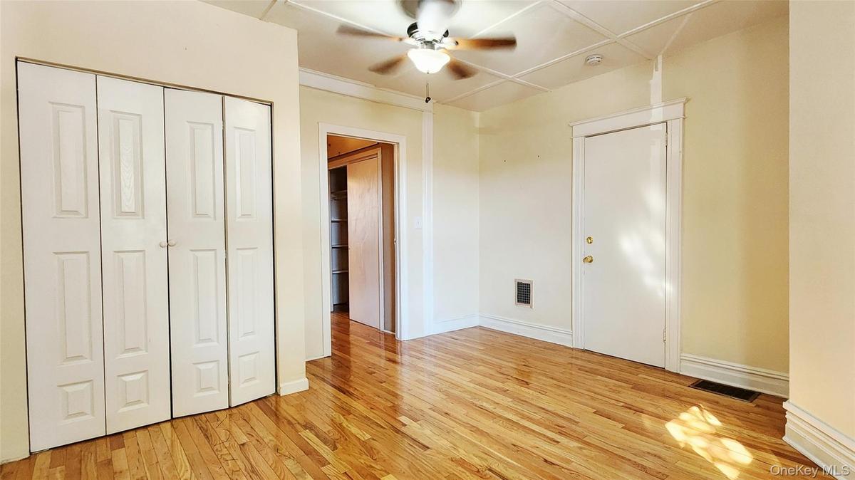 1st floor- front bedroom with large built-in closet and access to common area hallway