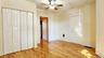 1st floor- front bedroom with large built-in closet and access to common area hallway