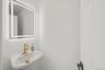 Half Bath next to entry stairs offthe kitchen
