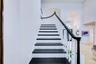 Stairs to two ensuites