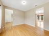 LIVING ROOM W/ VIEW OF DEN