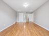 ANOTHER VIEW OF PRIMARY BEDROOM W/ VIEW OF BATH