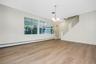 view of Dining area to covered patio/screen room and upper level staircase
