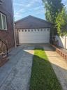 Two-car garage with extensive driveway