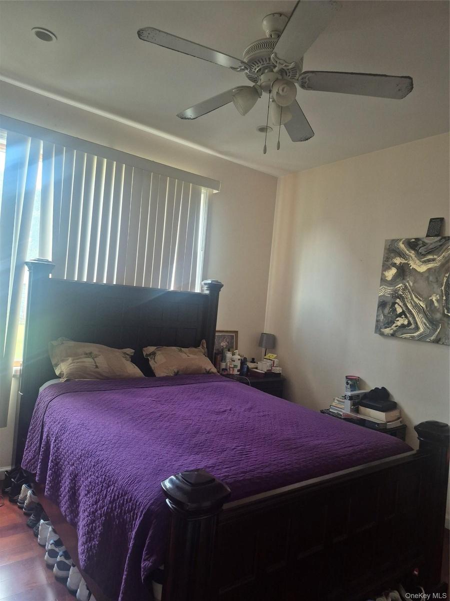 !st Floor Bedroom with wood flooring, recessed lighting, and a ceiling fan with integrated lighting, blinds and large window